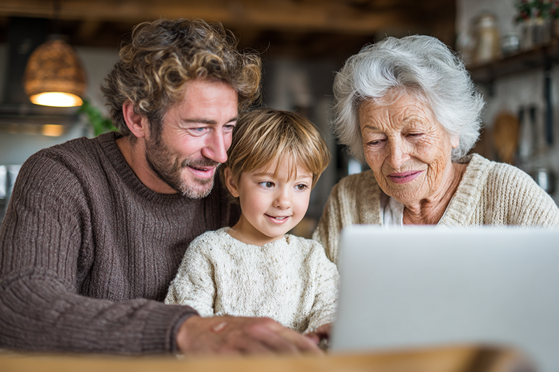 son and granddaughter with a grandmother at a laptop trying to decide what skilled nursing facility to go to in Shreveport, LA