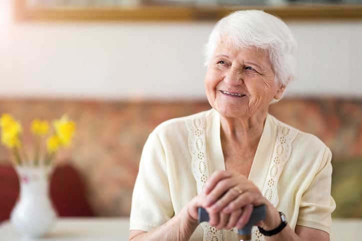 A caregiver comforting a resident in memory care