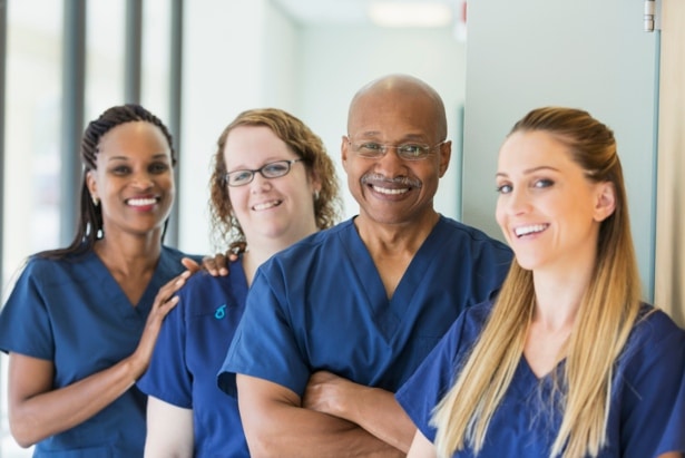 Four nurses gathered in a hallway, reflecting their passion for nursing