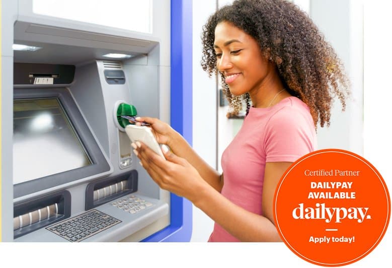 A lady is withdrawing the cash from the atm and checking her bank balance