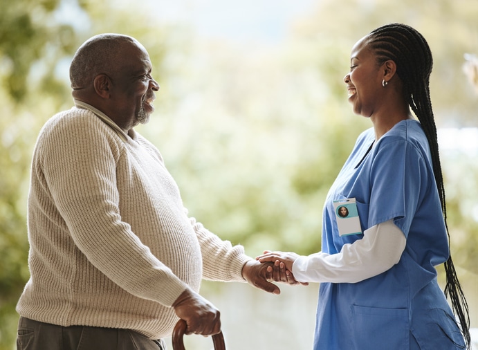 Nurse speaking to her senior patient in short term rehabilitation care at the bradford