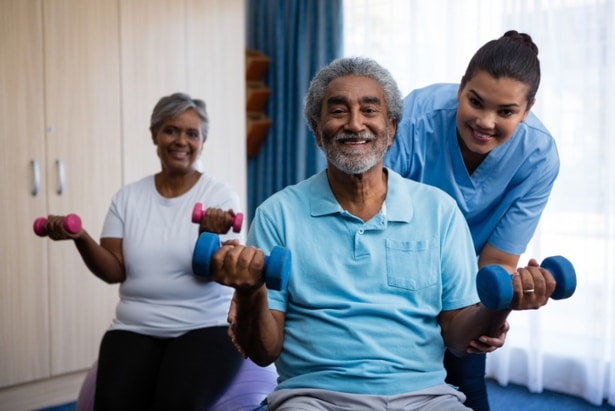 Two senior patients practicing physical therapy